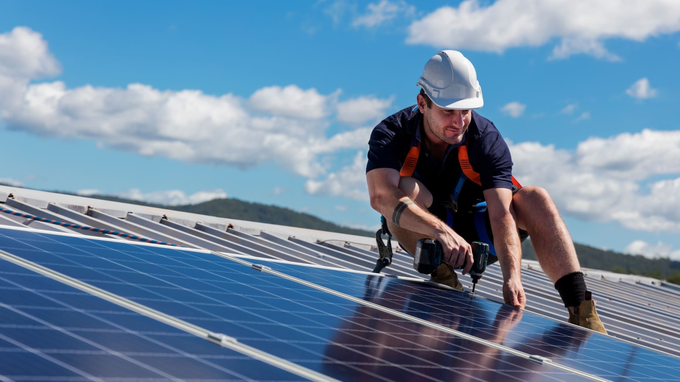 technician installing solar panels